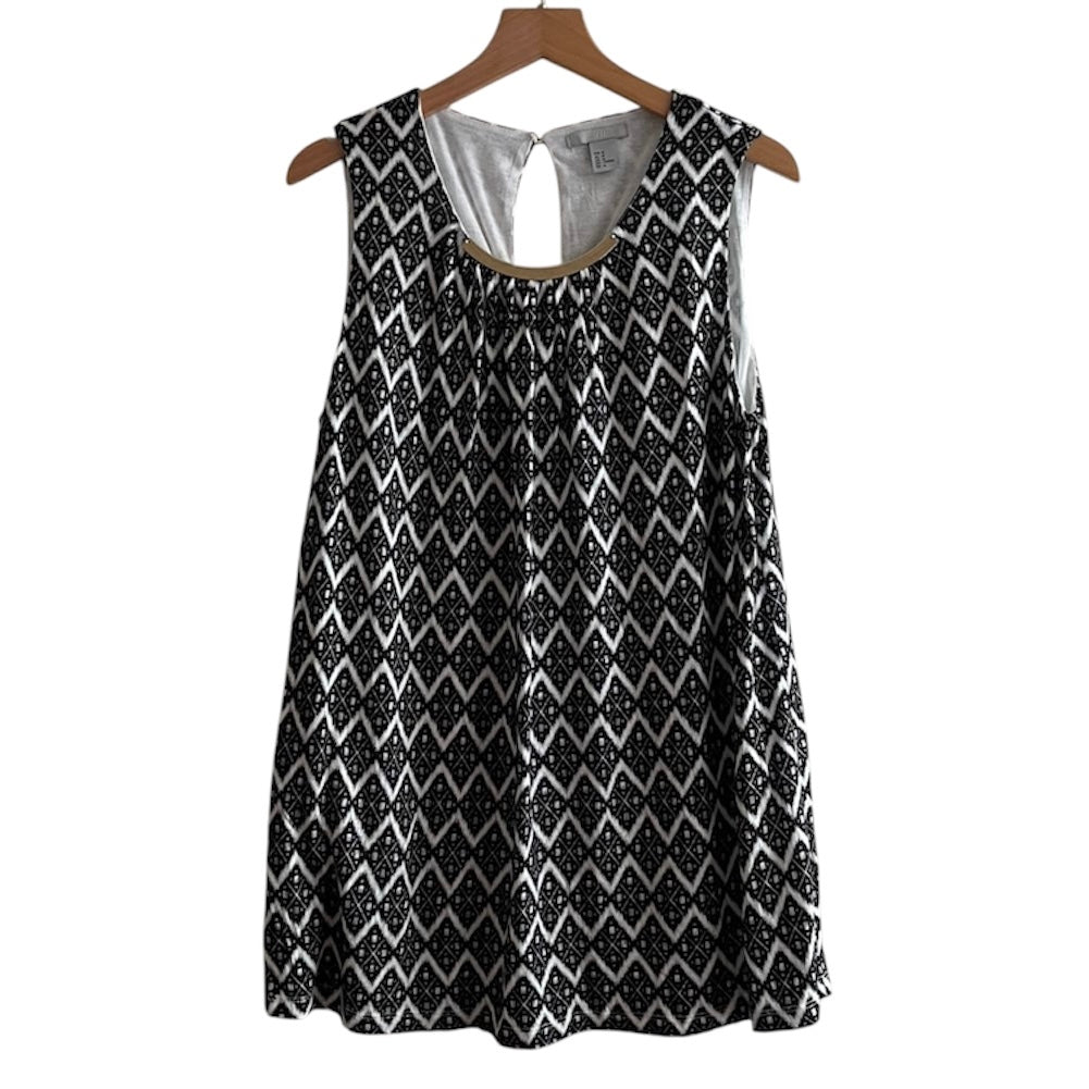 Blusa blanca y negra con aplicación en el cuello H&M - Talla M